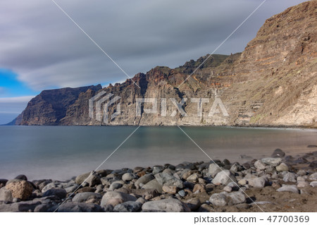 Los guios beach and Los Gigantes cliffs in Tenerife Los guios beach and Los Gigantes cliffs in Tenerife 47700369