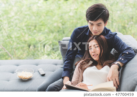 Asian teenage couple relaxingtime sit on sofa. 47700459