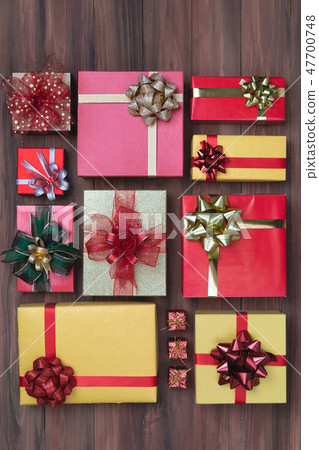flat lay shot of coloful boxs with colorful ribbon 47700748