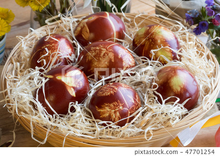 Easter eggs dyed with onion peels Easter eggs dyed with onion peels 47701254