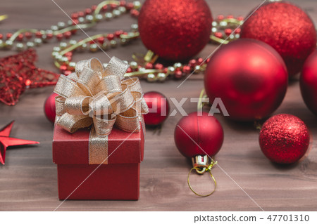 Red gift box with golden ribbonsoft blur backgound 47701310