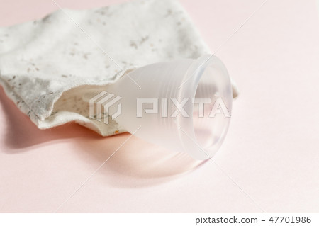 Menstrual cup on pink background, feminine hygiene Menstrual cup on pink background, feminine hygiene 47701986