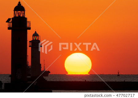 Sunset and lighthouse 47702717