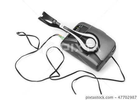 Old cassette player and headphones 47702987