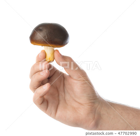 Hand with mushroom 47702990
