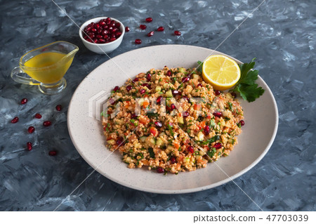 Turkish Kisir salad with wheat. Close up.  47703039