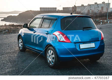 The photo of the blue car 47703167