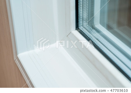 Photo of a white window sill 47703610
