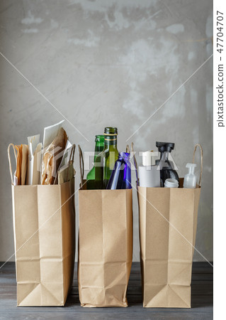 Three paper bags with sorted household waste Three paper bags with sorted household waste 47704707