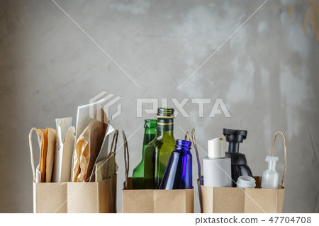Three paper bags with sorted household waste Three paper bags with sorted household waste 47704708