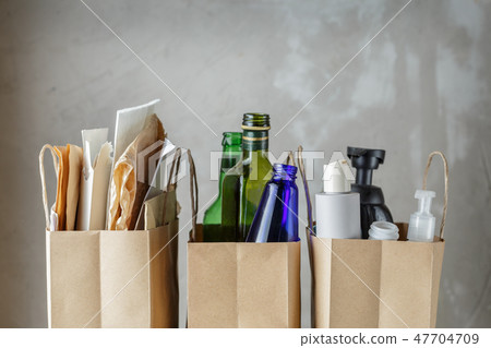 Three paper bags with sorted household waste Three paper bags with sorted household waste 47704709