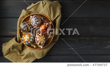 Easter eggs decorated with wax resist technique 47704737