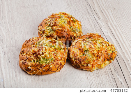 Ruddy fresh beautiful buns on a wooden background. Ruddy fresh beautiful buns on a wooden background. 47705182