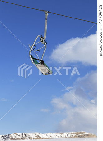 Ski-lift and blue sky with clouds at winter day 47706428