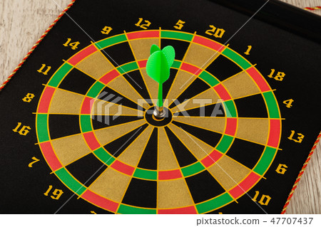 The game of darts, darts on the target. 47707437