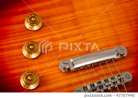 Old beautiful electric guitar on a background of 47707440