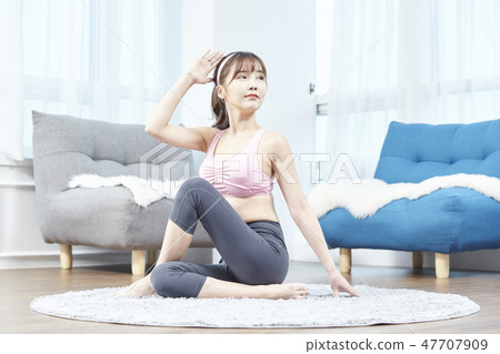 Stretching, exercise, fitness, yoga, pilates, young woman Stretching, exercise, fitness, yoga, pilates, young woman 47707909