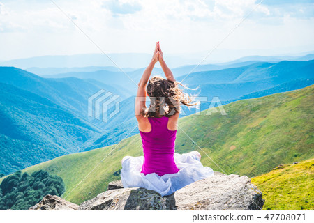 Young woman on the top of mountain Young woman on the top of mountain 47708071