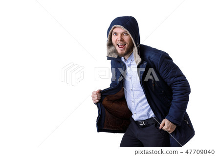 Smiling young man in winter warm coat. Smiling young man in winter warm coat. 47709040