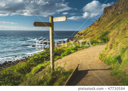 Close-up crossroad signpost. Ireland shoreline. Close-up crossroad signpost. Ireland shoreline. 47710584