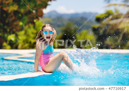 Child in swimming pool. Summer vacation with kids. 47710917