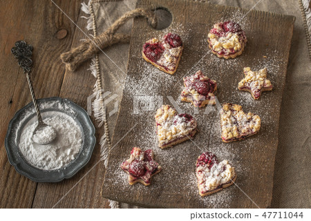 Shortbread biscuits with cherry filling Shortbread biscuits with cherry filling 47711044