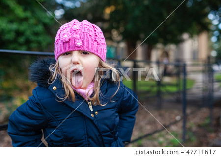 Cute naughty girl with pink hat 47711617
