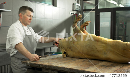 Professional butcher at slaughterhouse. 47712269