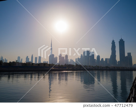 Panorama of the city of Dubai early in the morning at sunrise with a bridge over the city channel Panorama of the city of Dubai early in the morning at sunrise with a bridge over the city channel 47712479