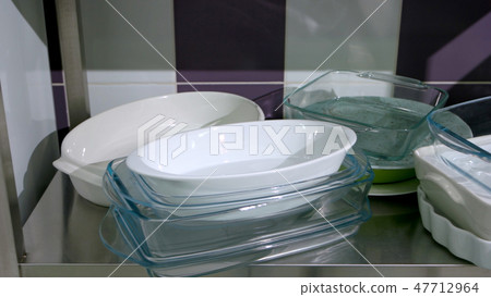 Set of glass baking trays at kitchen. Set of glass baking trays at kitchen. 47712964