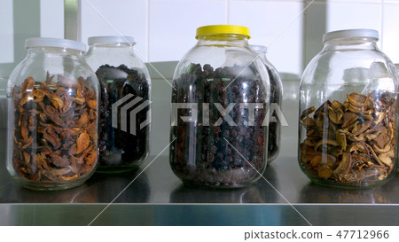 Glass jars with dried fruits. Glass jars with dried fruits. 47712966