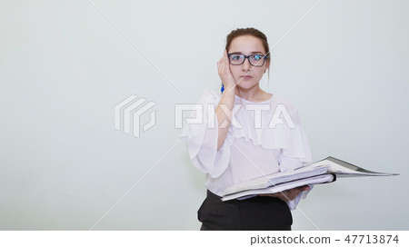 A schoolgirl in glasses depicts a successful girl with notes. A student depicts a reverie. The 47713874
