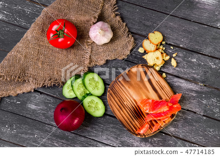 Fresh vegetables on wooden board with a napkin  Fresh vegetables on wooden board with a napkin  47714185