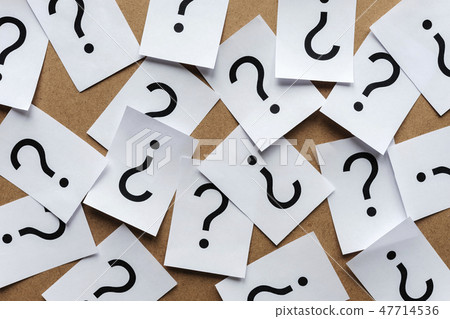 Scattered question marks printed on white paper Scattered question marks printed on white paper 47714536