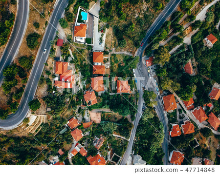 Old european city with red tiled roofs of houses 47714848