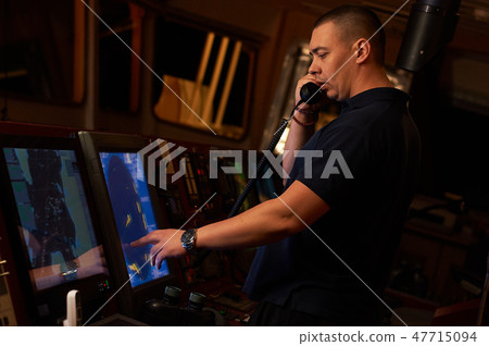 Navigation officer. Pilot on a bridge of a vessel Navigation officer. Pilot on a bridge of a vessel 47715094