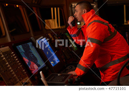Navigation officer. Pilot on a bridge of a vessel 47715101