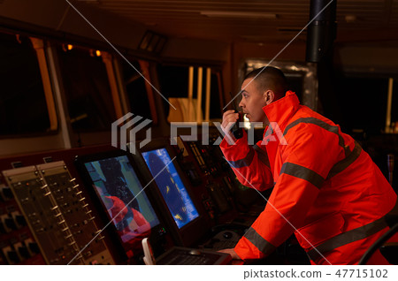 Navigation officer. Pilot on a bridge of a vessel 47715102