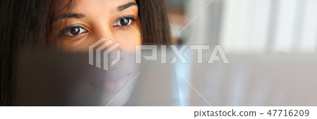 Female black doctor hold in arm and look 47716209