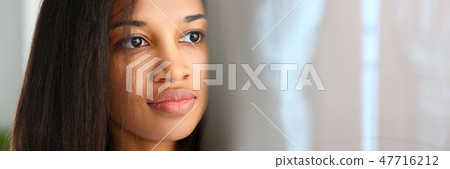 Female black doctor hold in arm and look 47716212