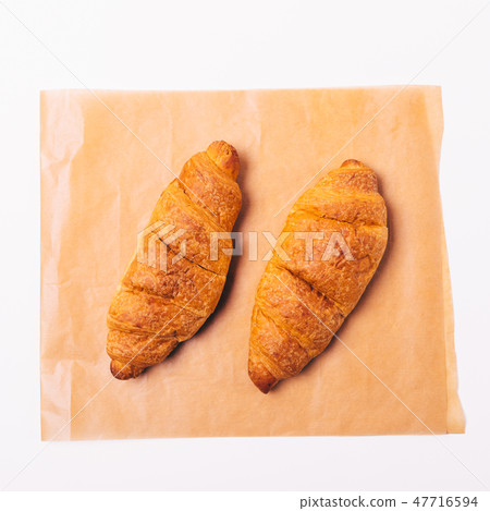 Close-up two cooked croissants Close-up two cooked croissants 47716594