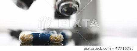 Tablets scattered on the table of the 47716753