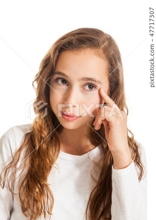 Beautiful young girl thinking or having an idea Beautiful young girl thinking or having an idea 47717307