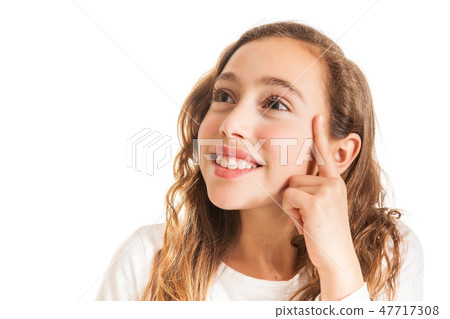 Beautiful young girl thinking or having an idea Beautiful young girl thinking or having an idea 47717308