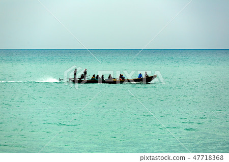 Boat with fishermen in the sea 47718368