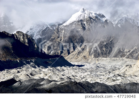 Godjjamba glacier covered with rocky earth and sand 47719048