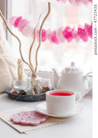 Still life of used candles, tea, teapot, pillow  47723438