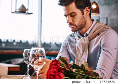 Waiting minutes before a meeting. Close-up of man is chatting while waiting 47723620