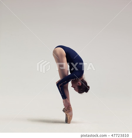 beautiful ballet dancer posing on pointes. 47723810