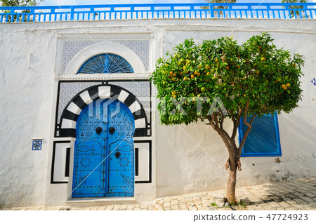 The streets of Tunisian Blue Sidibuside Orange tree and the blue door The streets of Tunisian Blue Sidibuside Orange tree and the blue door 47724923